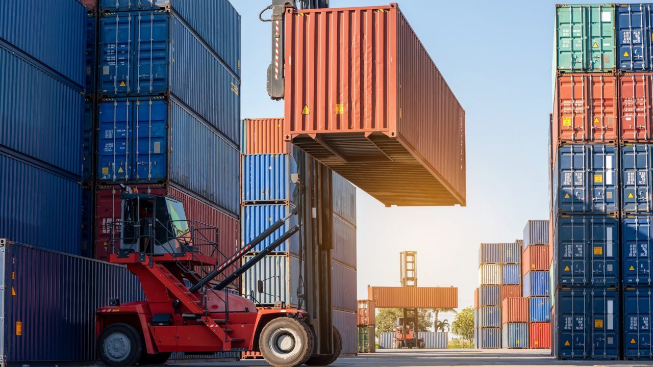 forklift working in the container cargo yard port loading cargo tank logistic service and transport